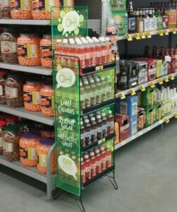 a beverage display with multiple flavors of drink inside a store
