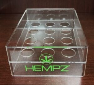 an acrylic display with a hemp-inspired logo